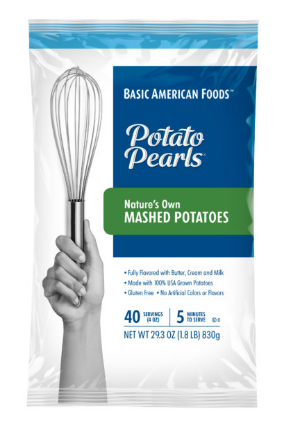 A box of Basic American Foods Potato Pearls® Nature’s Own Mashed Potatoes, featuring a hand holding a spatula, product details on the front.
