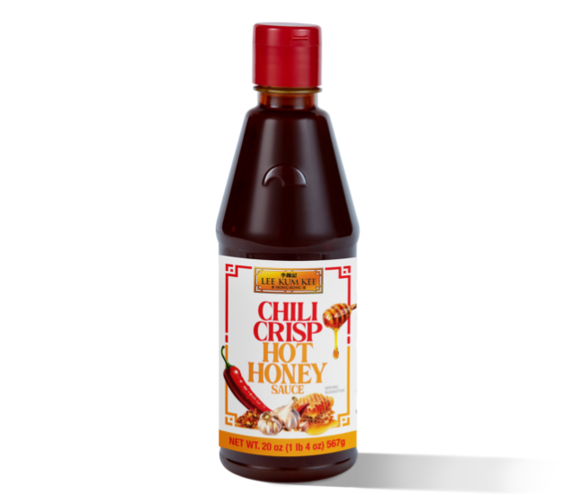 A bottle of Lee Kum Kee Chili Crisp Hot Honey Sauce with a red cap, featuring a label that shows chili peppers, honey dipper, and honeycomb graphics.